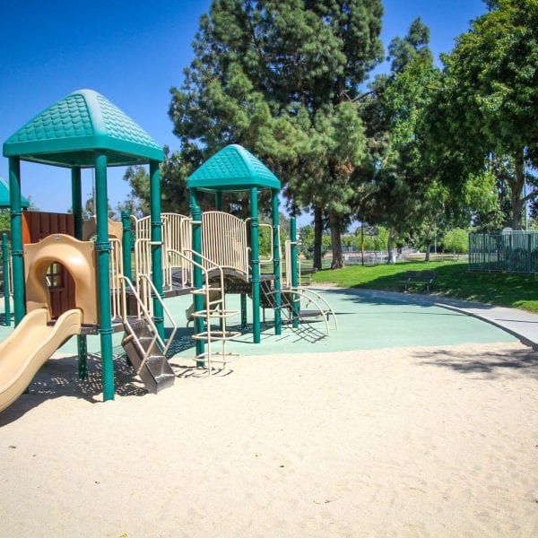 Playground on a sand bed and rubber turf
